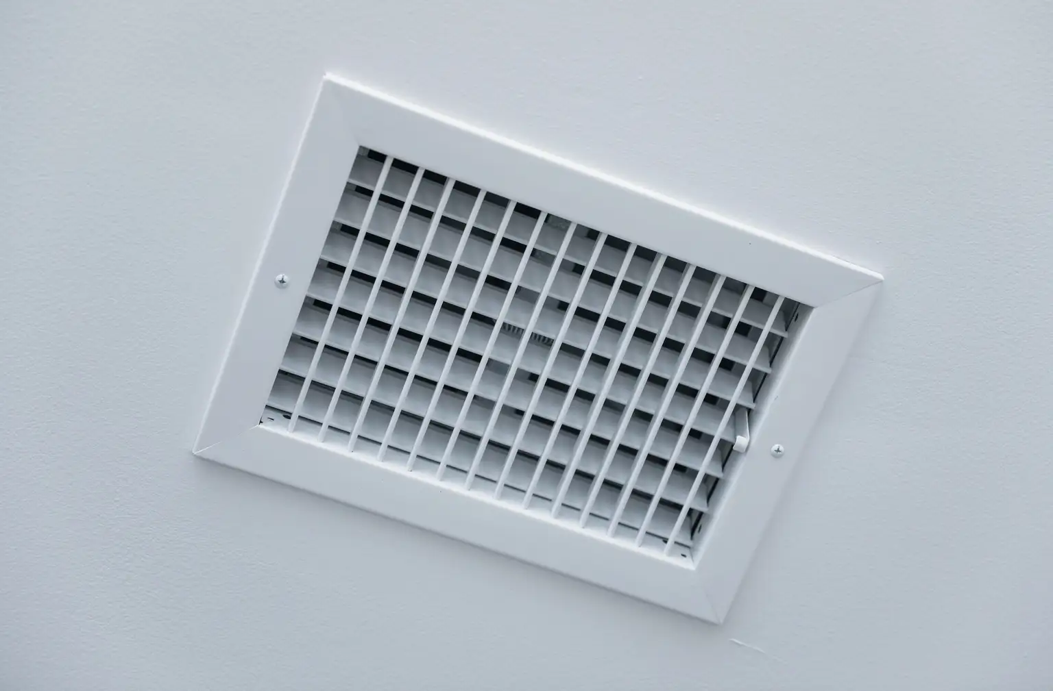 Register booster fan installed in floor vent