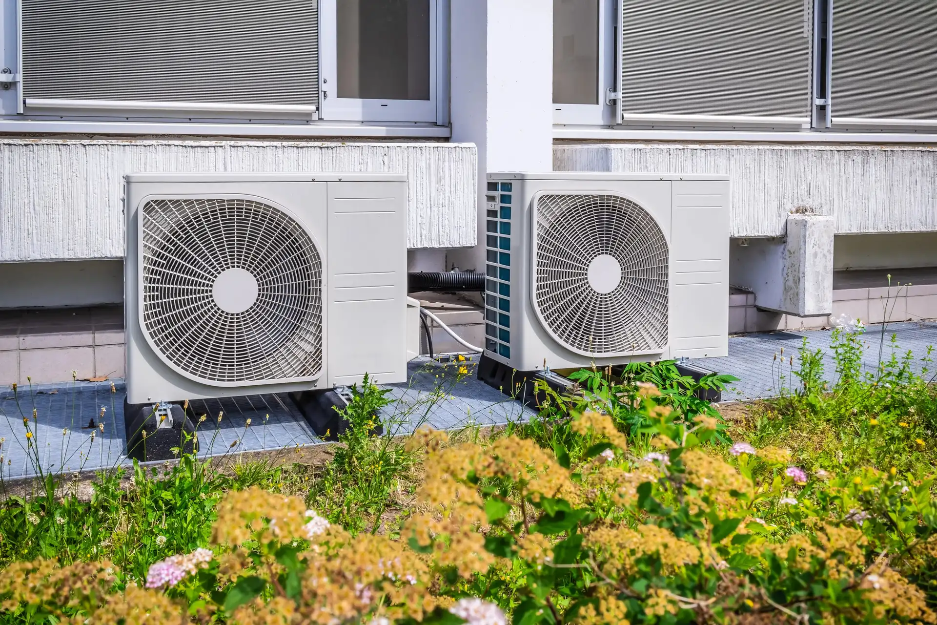 Modern air-source heat pump outside a home
