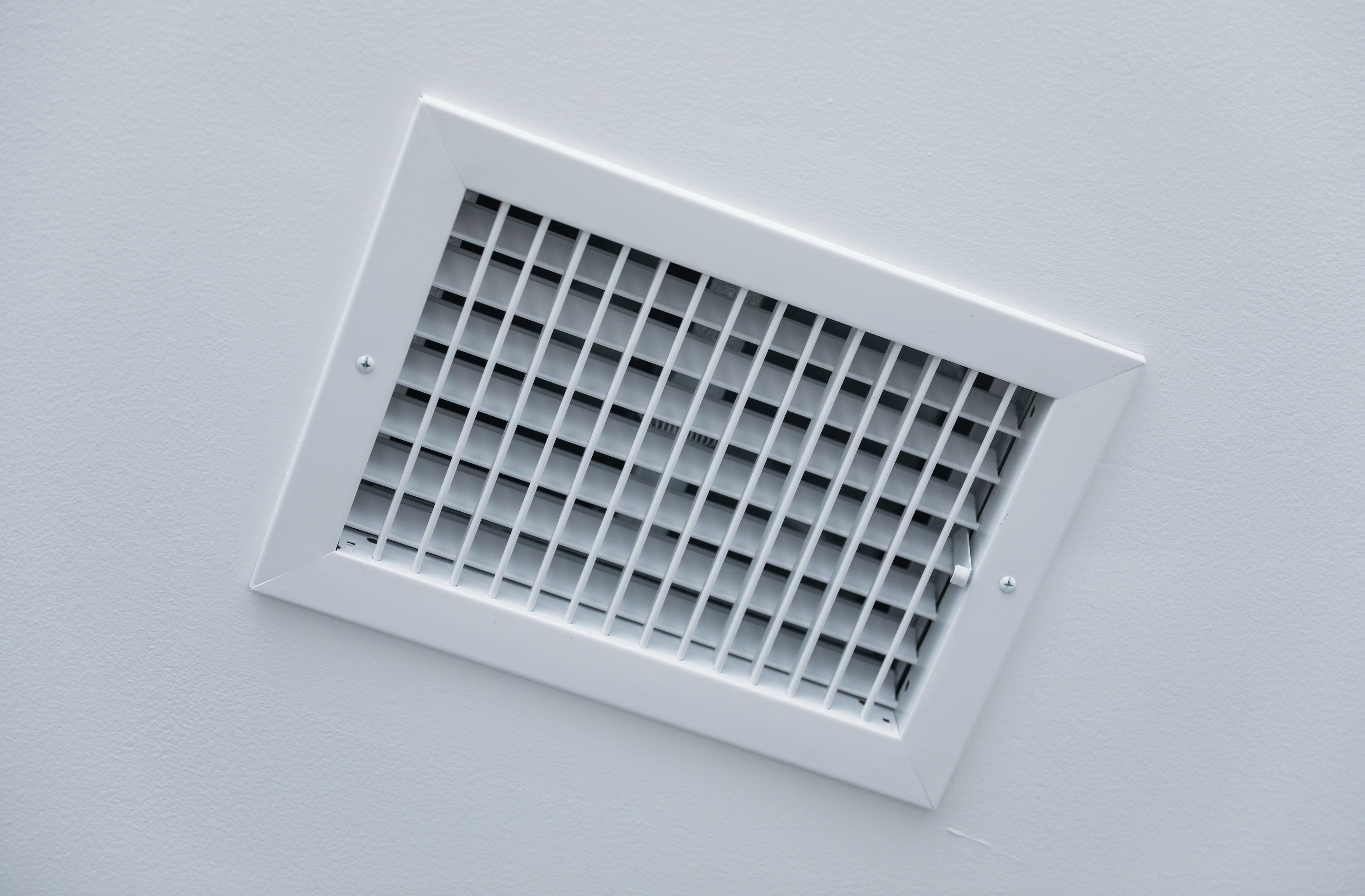 Register booster fan installed in floor vent